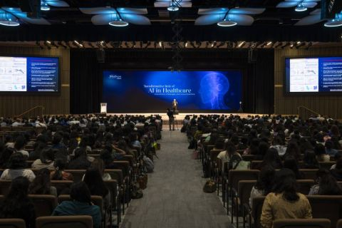 Main hall at HCP 2025, the session "Transformative Role of AI in Healthcare" underway in front of a packed audience.