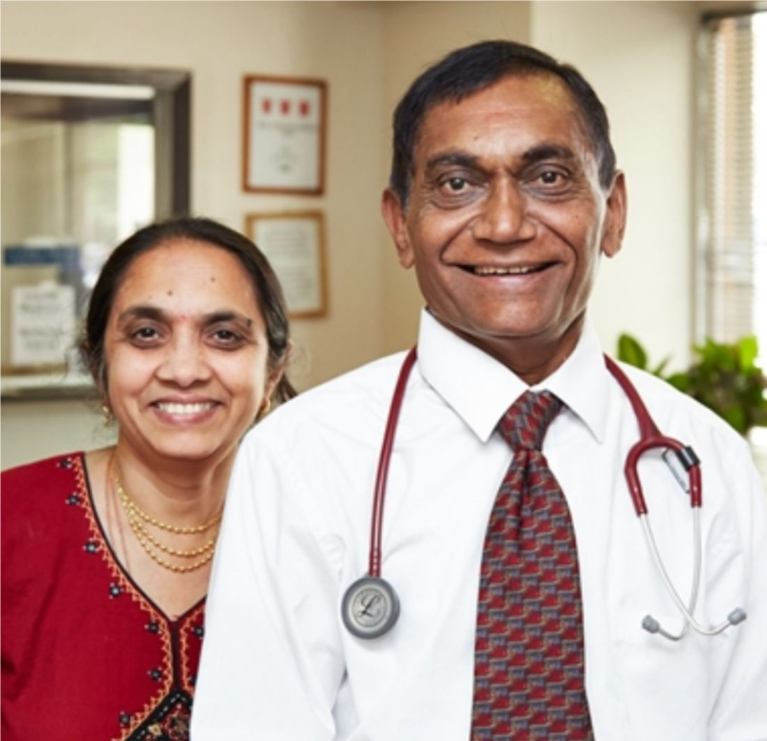 Portrait of Ashwin's mom and dad, dad in a white coat with stethoscope